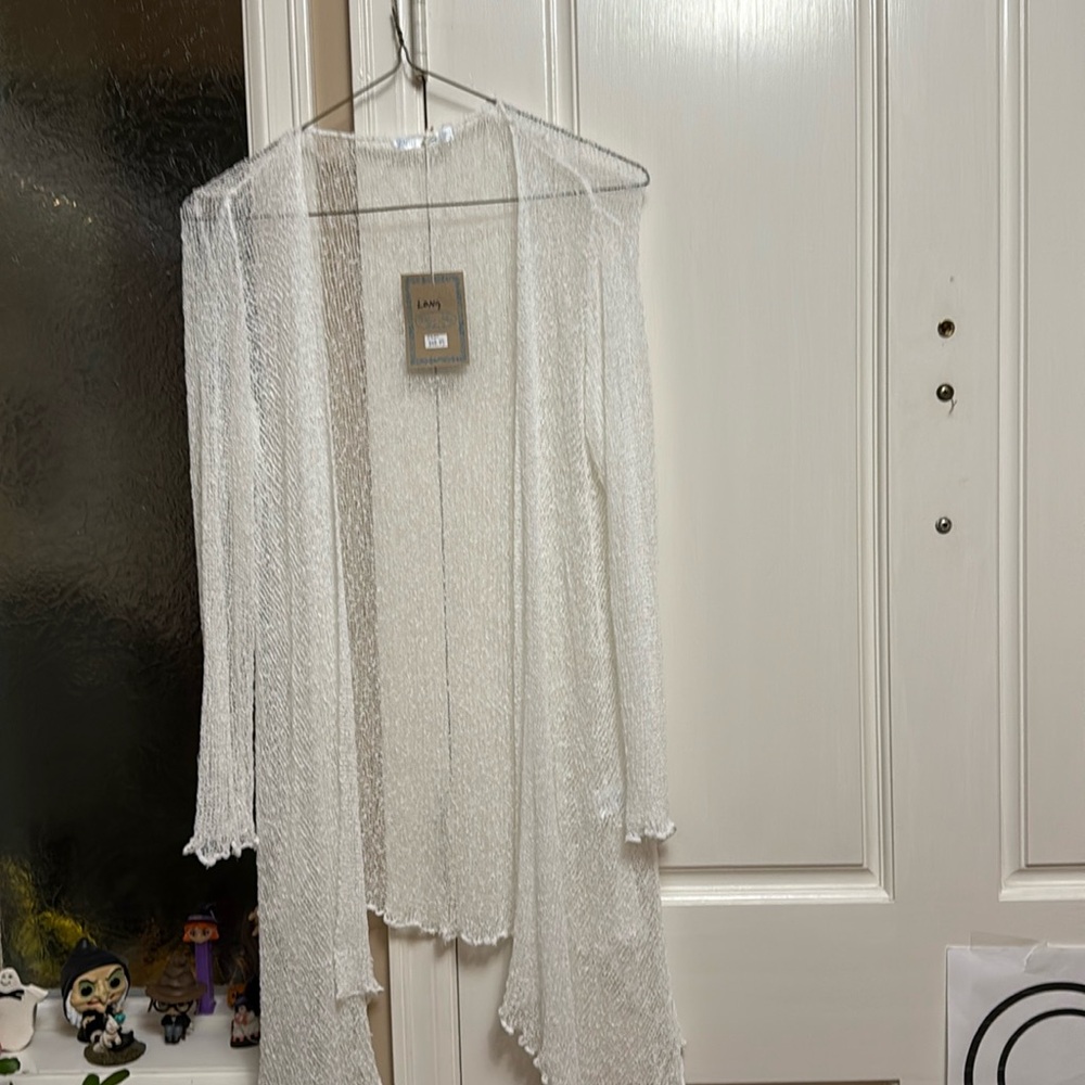 White Lacey asymmetrical sweater. One size. Long length 27”.